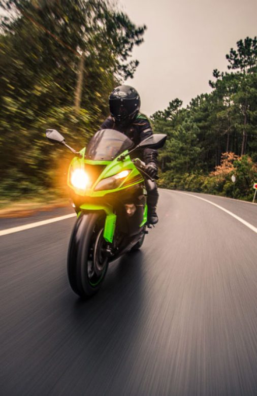 driving-green-neon-color-motorcycle-road-dusk-time
